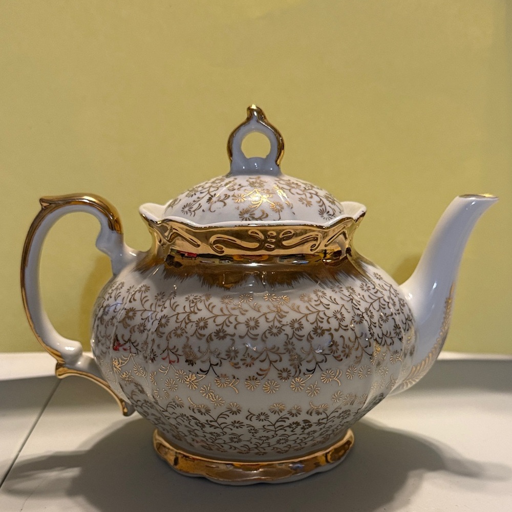 Elegant Gold and White Teapot